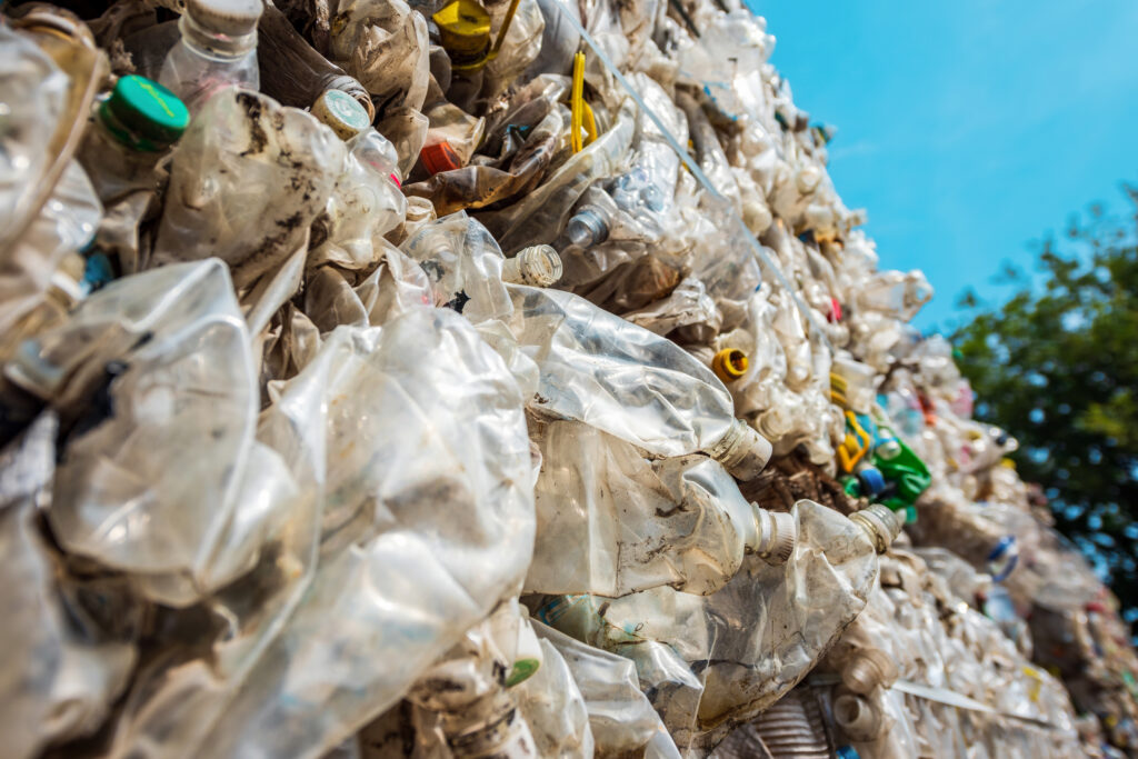 cube of compressed plastic garbage at a waste recycling factory